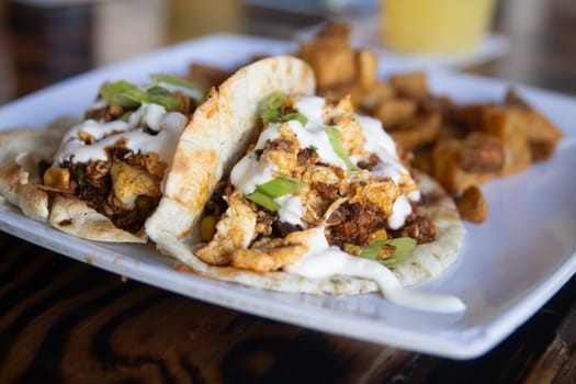Breakfast Pork Tacos served with potatoes