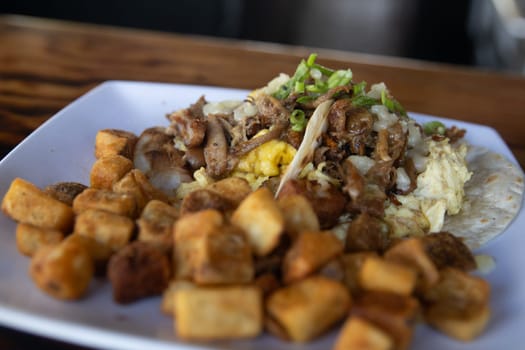 Breakfast Pork Tacos with side of potatoes