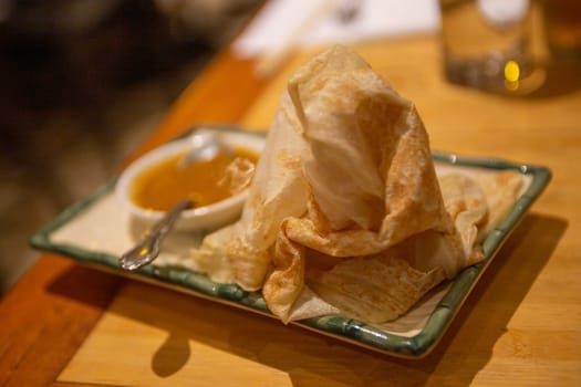 Roti Canai with Curry Sauce as an appetizer