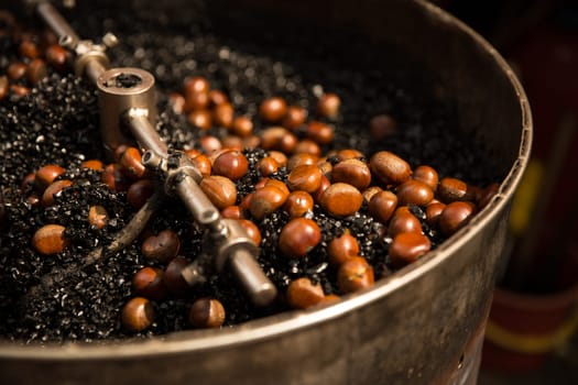 Roasting  Chestnuts on hot Coal churning