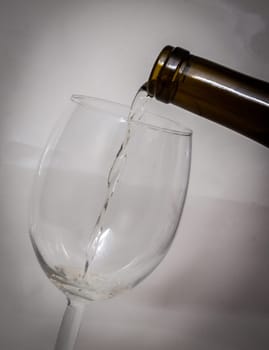 Pouring wine into a wine glass