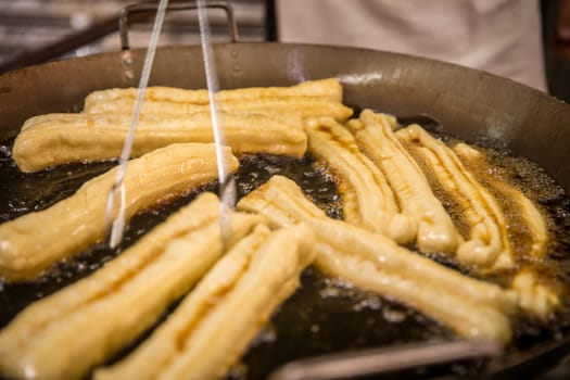 Frying Chinese Donuts as Street Food in asia