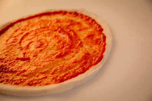 Swirly Dough for Pizza making with marinara sauce