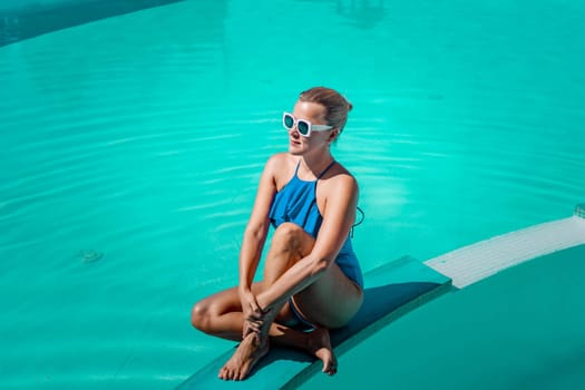 Bikini-clad woman enjoys poolside relaxation. Poolside ambiance. Capturing woman's relaxed time near pool