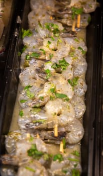 Marinated shrimp skewers at the market
