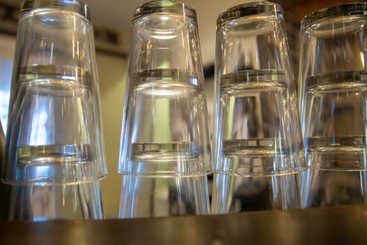 Empty Beer glasses on the bar stacked