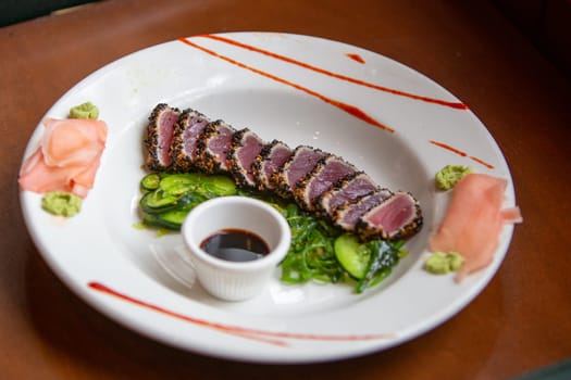 Black and White Sesame Tuna appitizer with seaweed salad