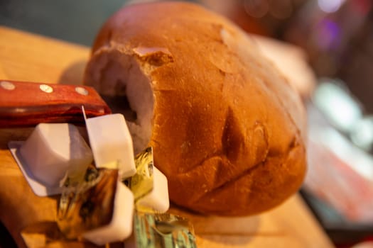 Loaf of bread with containers of butter