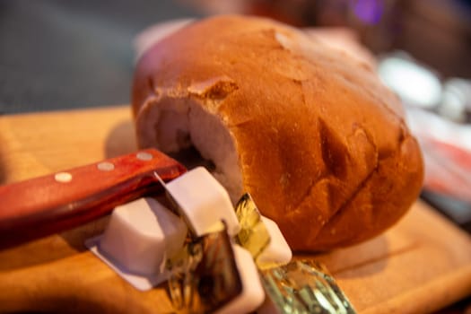 Loaf of bread with containers of butter