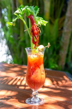 Crawfish bloody mary with celery and a frawfish