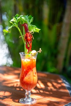 Crawfish bloody mary with celery and a frawfish