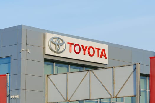 Tyumen, Russia-March 02, 2024: Toyota logo Sign Against Blue Sky. Selective focus