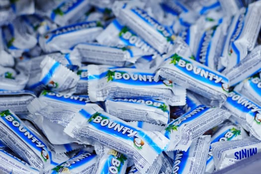 Tyumen, Russia-March 05, 2024: Bounty minis candy. Chocolate bars are made by Mars Inc. Selective focus