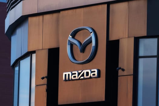 Tyumen, Russia-March 18, 2024: Mazda logo prominently. The logo is identifiable and adds to the buildings branding.