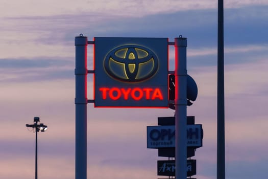 Tyumen, Russia-March 18, 2024: Toyota sign standing prominently against a clear blue sky, showcasing the iconic brand logo