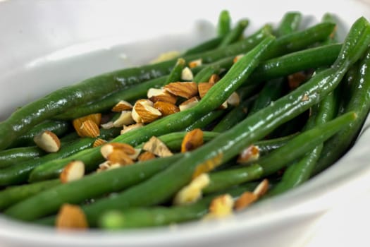 Green bean almandine on white