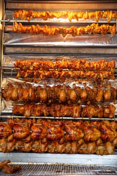 Racks of Chicken Roasting at a market