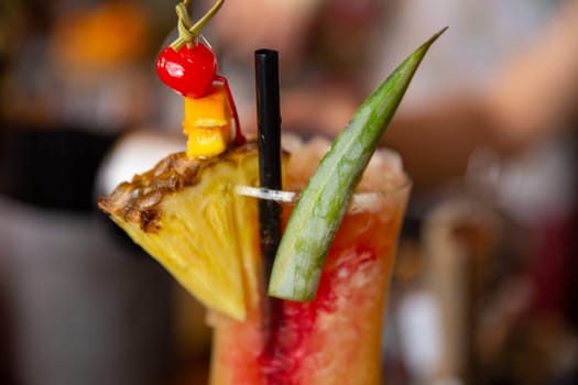 A Tropical Iced Drink with fruit garnishes
