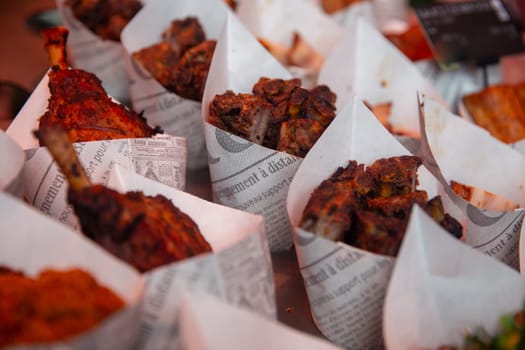 various fried snacks in cones at the market
