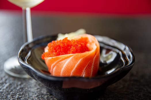 Fresh Salmon Sashimi with a glass of white wine