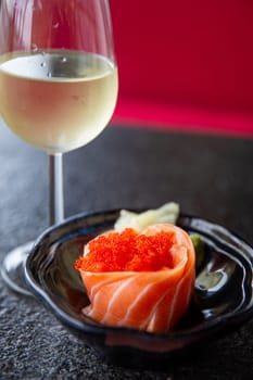 Fresh Salmon Sashimi with a glass of white wine