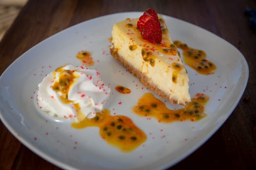 Passion Fruit Cheese cake with strawberry toppings