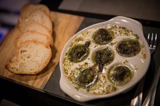Baked Escargot with Bread and utensils