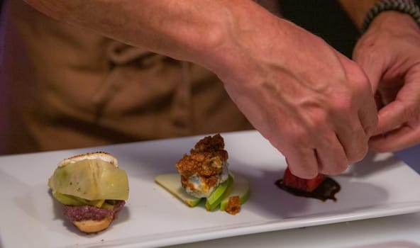 French chef preparing a variety of appetizer