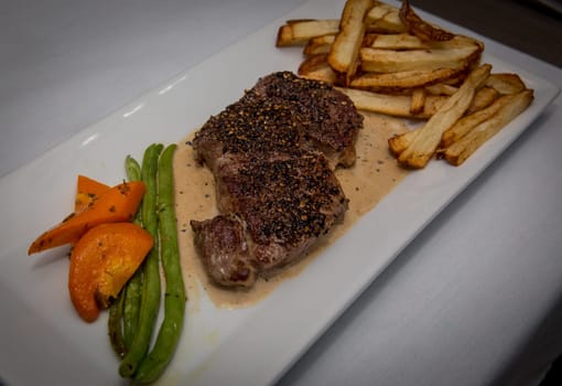 Steak and Fries Dinner served with vegetables and fries