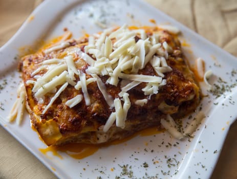 Lasagna made from scratch served and garnished