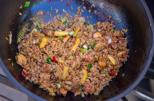 Pineapple Pork Fried Rice in a wok