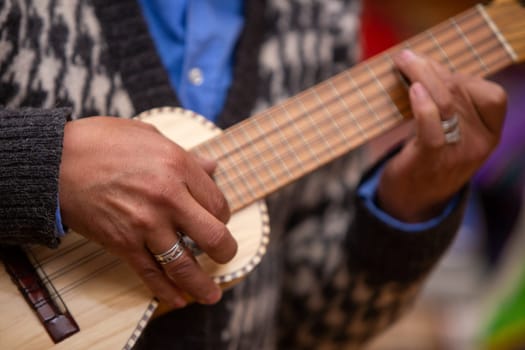 Peruvian Man playing Small Guitar