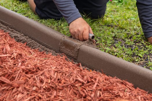 Garden worker shaping a border by HOA Regulations