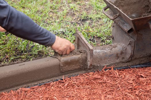 Residential worker shaping a border in the community