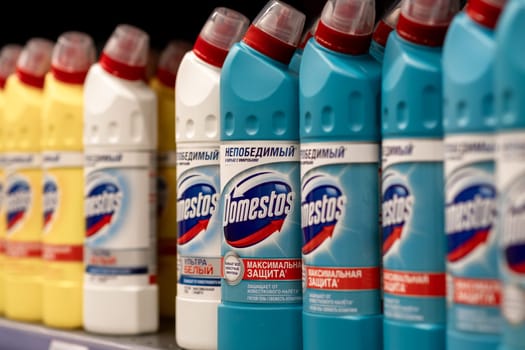 January 25, 2024, Kemerovo, Russia. Supermarket shelves are filled with a long row of bottles of Domestos. Disinfectant, toilet cleaner and disinfectants. Kills viruses.