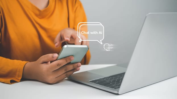 Woman hand use show a smartphone to type live chat, ask, answer with an artificial intelligence system. chatbot. Ai assistant.