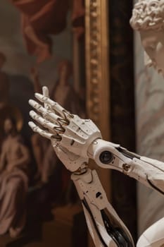 A robot with hands folded in prayer pose next to a painting