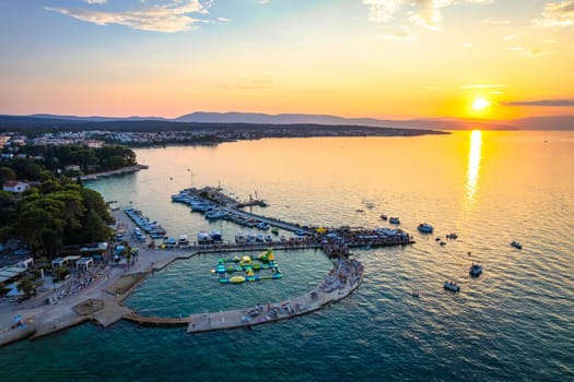 Malinska waterfront beach and turquoise coastline sunset view, Island of Krk tourist destination in Croatia