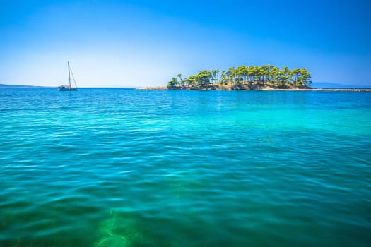 Idyllic sailing islet in Island of Rab archipelago view, turquoise sea of archipelago of Croatia