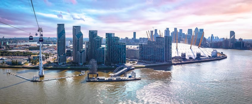 Thames river Greenwich Peninsula and Canary Wharf in London panoramic view from cable car, capital of United Kingdom