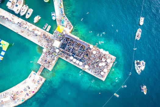 Beach party on pier aerial view, Malinska on Krk island of Croatia
