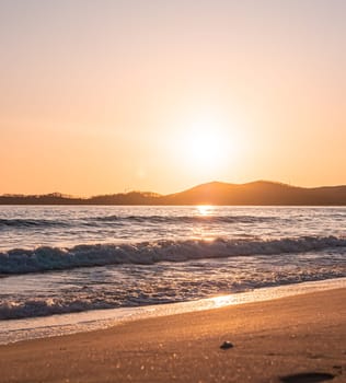 Sunset on the beach. Orange and golden sunset sky calmness tranquil relaxing sunlight summer mood.