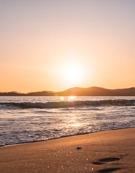 Sunset on the beach. Orange and golden sunset sky calmness tranquil relaxing sunlight summer mood.