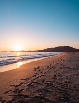 Sunset on the beach. Orange and golden sunset sky calmness tranquil relaxing sunlight summer mood.