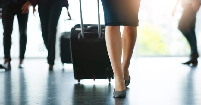 Airport, legs or businesswoman with luggage walking for travel, airplane flight and terminal gate for trip. Floor, busy or suitcase bag for a journey, international transportation or global tour.