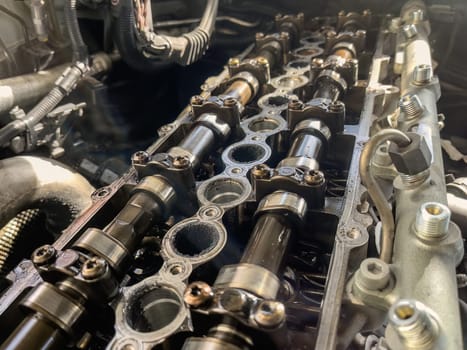 Close-up of camshafts and deposits on a diesel engine caused by EGR.