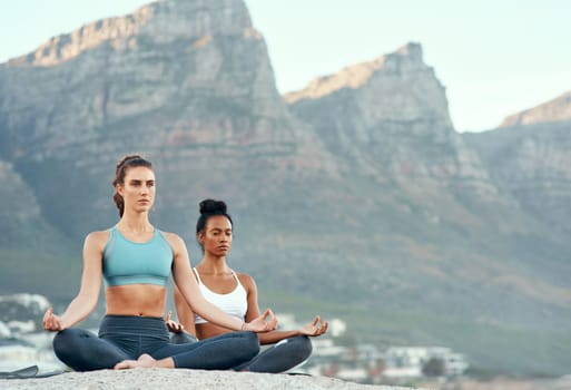 Fitness, meditation and yoga with friends on beach for mental health, peace or wellness in morning. Exercise, training and zen with women on space at coast by ocean or sea for balance and mindset.