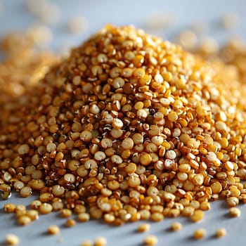 A pile of brown grains, known as cumin seeds, is sitting on a table. This plantbased ingredient is commonly used as a spice in various cuisines to add flavor to dishes