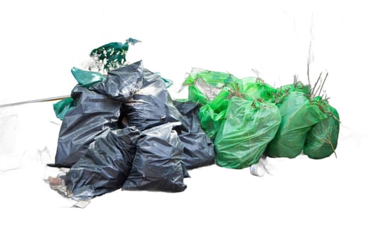 Isolated piles of trash bags in green and black colors. Perfect for waste management, sanitation, and environmental graphics