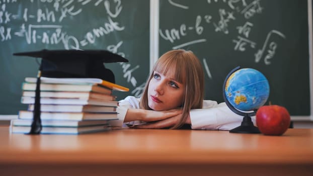 Blonde schoolgirl with bangs poses in front of school objects.
